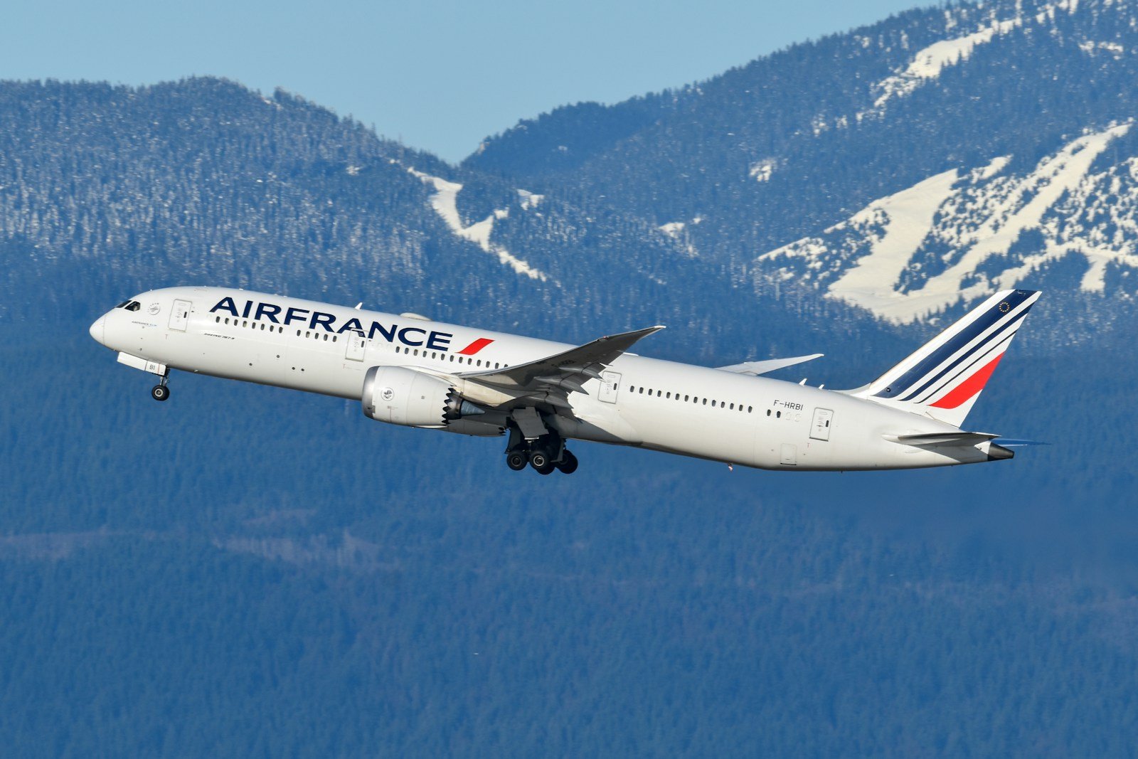 An airfrance airplane flying over a mountain range
